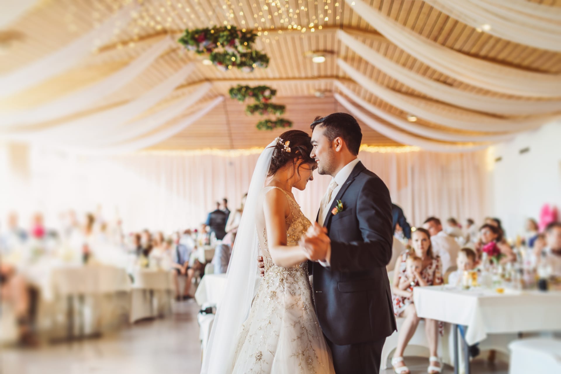 Bride and groom sharing their first dance at a Sunshine Coast wedding reception with DJ and lighting